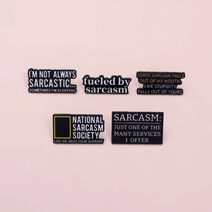 Minimalist black enamel pins set with sarcastic English quotes on pink background