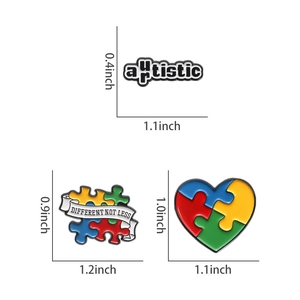Three enamel autism awareness brooches with puzzle heart and motivational quotes