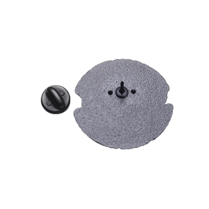 Detailed view of the matte grey metal badge back with a durable black rubber clutch