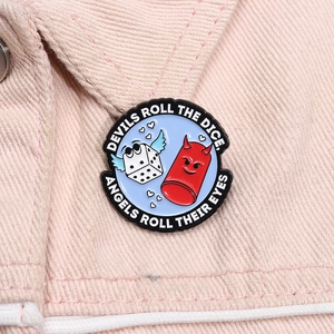 Close-up of a devil and dice enamel pin on pink denim jacket with creative typography