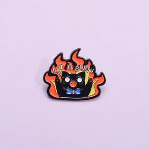 Cartoon black cat enamel pin with flames and Let It Burn text for jackets and bags