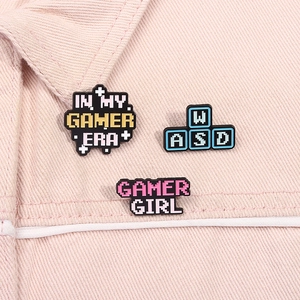 Three-piece set of pixel art gamer enamel pins featuring WASD keys and gamer girl slogans