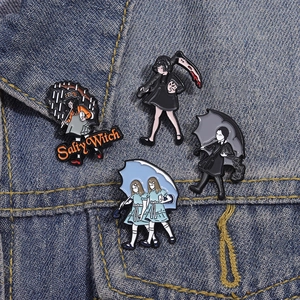 Gothic anime enamel pin set featuring cartoon girls and salty witch icons on denim jacket