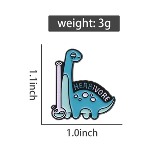 Detail of blue dinosaur enamel pin with Herbivore text and unique bong pattern design