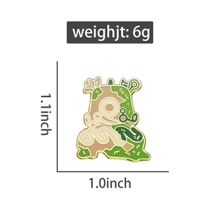 Abstract nature enamel pin in green and gold finish with dimensions of 1.1x1.0 inches