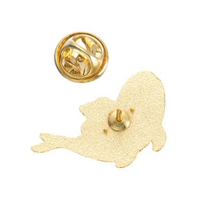 Detailed back view of gold enamel whale brooch showing the pin and butterfly clutch