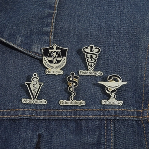 Set of 5 medical enamel pins including pharmacy and dental icons on blue denim fabric