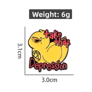 Détail d'un pin's canard jaune en émail avec inscription take that Depression et étoile