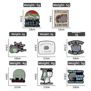 Detailed view of eight funny weightlifting frog enamel pins with dimensions and weight specs