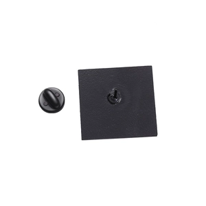 Macro shot showing the black matte square enamel pin back and rubber clutch fastener