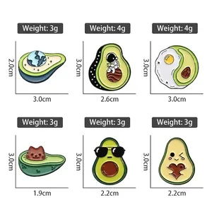 Set of six creative avocado enamel pins featuring astronaut, cat, and egg themes