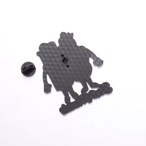 Detail view of cartoon character enamel pin back with honeycomb texture and rubber clutch