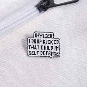 Close-up of funny enamel pin on white canvas bag with drop kicked text design