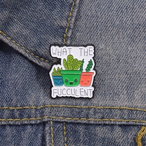 Funny succulent enamel pin with 'What the Fucculent' quote on denim jacket
