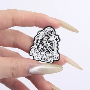 Cartoon skeleton drinking coffee enamel pin with 'All Of My Flabbers Are Gasted' text