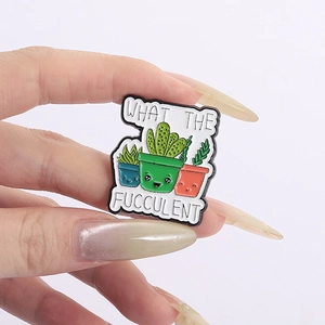 Funny cartoon cactus plant enamel pin badge with What The Fucculent pun lettering
