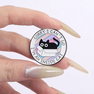 Round black cat enamel pin with 'Inside Cat' quote and colorful striped background