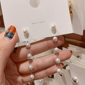 Elegant Korean style long tassel pearl drop earrings with multiple white round pearls