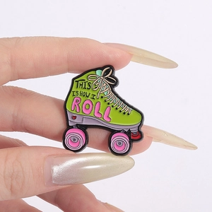 Retro roller skate enamel pin with 'This Is How I Roll' text on a green zinc alloy badge