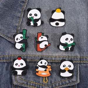 Set of 8 cute panda enamel pins with bamboo on denim fabric background