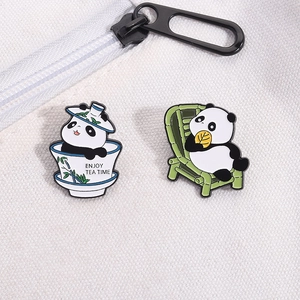 Cute panda enamel pins on canvas bag showing enjoy tea time and bamboo chair design
