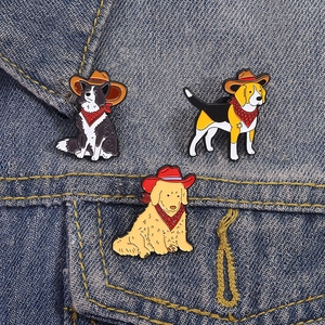 Three-piece dog enamel pin set with cowboy hats on dark blue denim jacket
