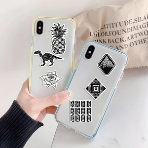 Handheld clear iPhone cases featuring artistic black and white geometric pineapple and rose prints