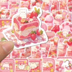 Close-up of cute pink strawberry cake sticker with a small white bear for decoration