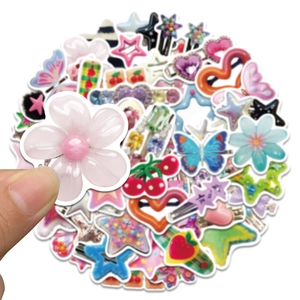Close-up of pink flower hair clip with various colorful Y2K style acrylic hair accessories