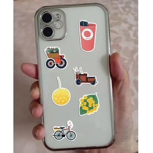 Flat design plant and object stickers applied on a transparent phone case held by hand