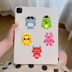 DIY cartoon monster puzzle stickers set of 8 showing decorative use on a white tablet