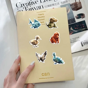 Detail of 3D origami animal stickers with geometric designs on a notebook cover