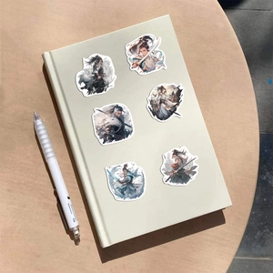 Close-up of ancient style warrior stickers applied on a notebook cover surface