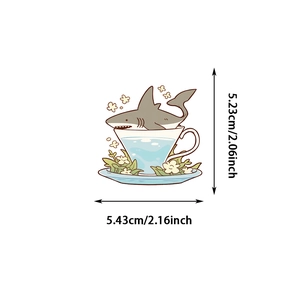 Detailed dimension view of cute shark in a coffee cup sticker measuring 5.23cm by 5.43cm