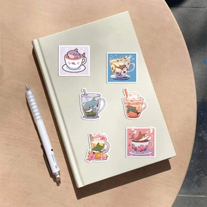 6 pieces of cute cartoon shark stickers on a green notebook with a white pen
