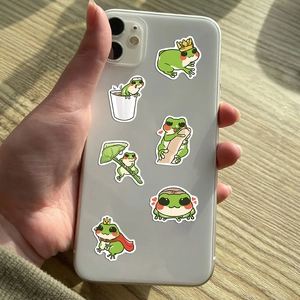 Waterproof cartoon green frog stickers applied to the back of a white smartphone case