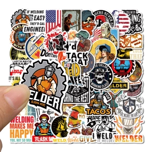 Detail showing waterproof welder stickers with professional slogans and flag designs