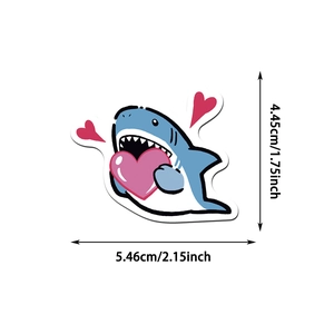 Detail view of a cartoon blue shark sticker with size dimensions 5.46cm by 4.45cm