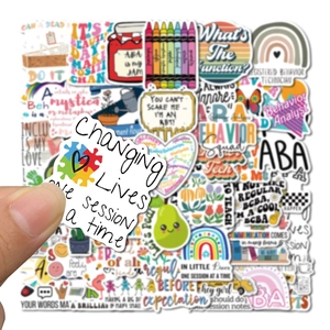 Close-up of ABA therapy stickers with colorful puzzle patterns and inspiring quotes