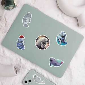 50pcs manatee and seal stickers for laptop and phone decoration on plush rug background