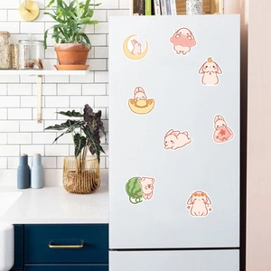 Set of 8 cute rabbit stickers in pastel colors on a white refrigerator surface