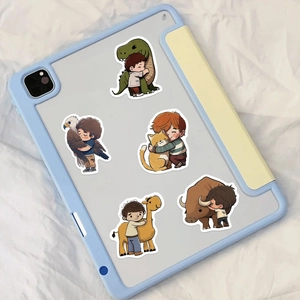 Detailed view of cute hand-drawn cartoon kid and animal stickers on a tablet case