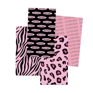 Detail showing four pink and black patterned decorative cards with Moonlight and Love Me motifs