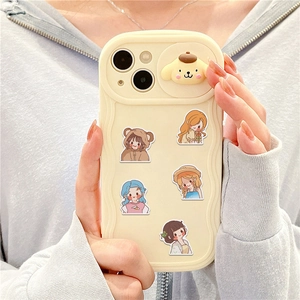 Detail showing wavy creamy white phone case with 3D cartoon dog and girl stickers