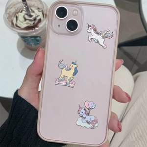 Pink matte iPhone case featuring three cute cartoon unicorn patterns and full camera protection