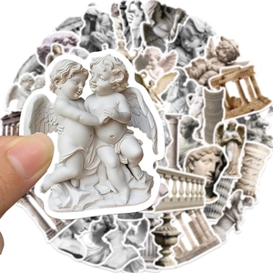 Hand holding classical art sculpture sticker from a 50-piece waterproof decal set