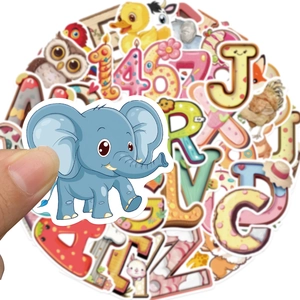 Hand holding a cute blue elephant sticker from a set of colorful animal and letter decals