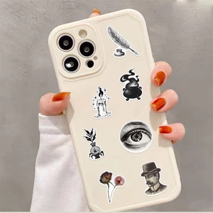 Macro detail of Gothic apothecary stickers on a beige phone case with vintage mystical designs