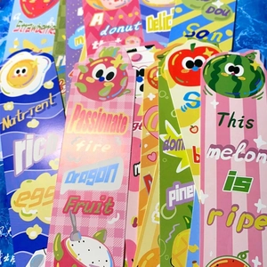 Detail shot of colorful cartoon food bookmarks with vibrant fruit patterns and thick cardstock