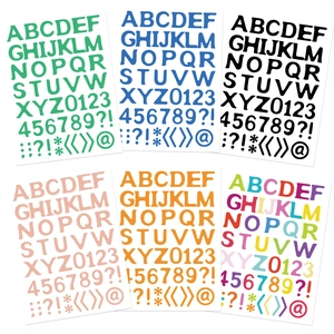 Detailed view of six colorful alphabet and number sticker sheets for DIY journaling decor